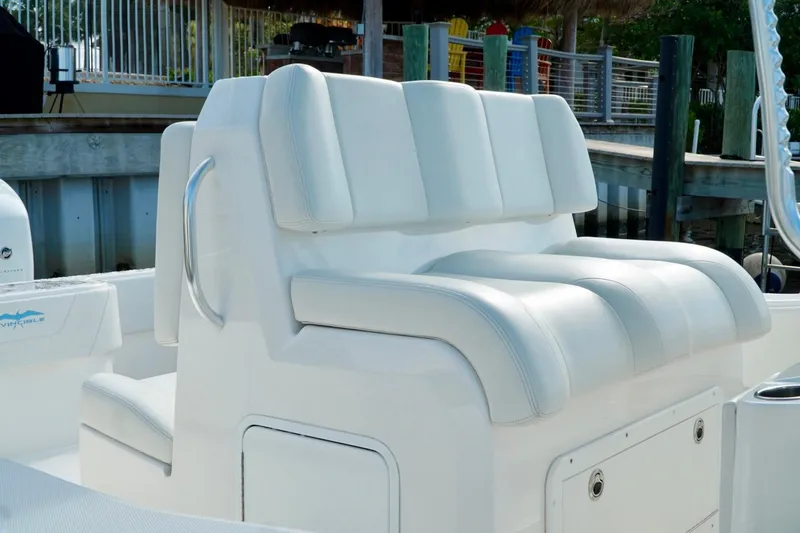 Slide: The Image of White leather seating on an Invincible boat, featuring sleek design and comfortable cushions. - 28