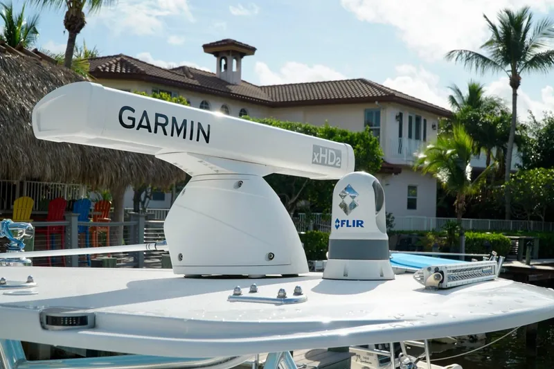 Slide: The Image of Garmin xHD2 radar and FLIR camera on Invincible boat, tropical background. - 35