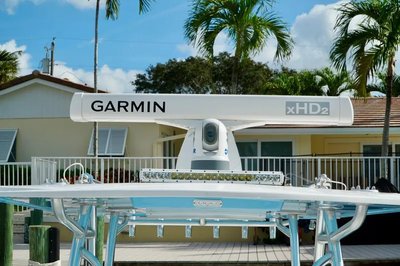 Slide: The Image of Garmin xHD2 radar on Invincible boat, tropical setting with palm trees. - 36