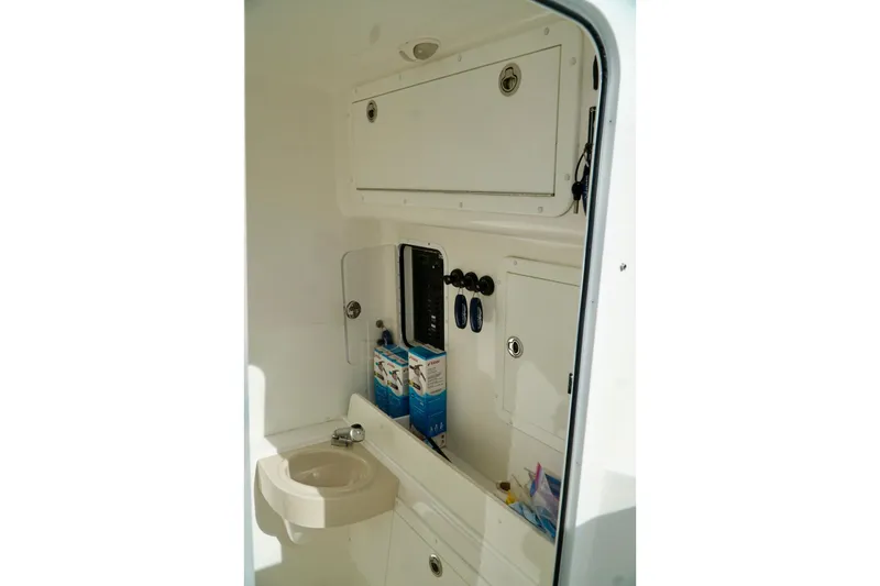 Slide: The Image of Compact boat interior with storage compartments and sink, Invincible make. - 41