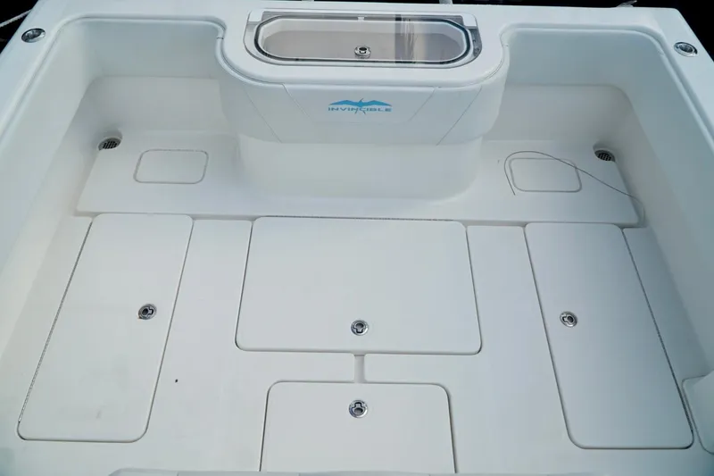 Slide: The Image of Spacious Invincible boat deck with storage compartments and livewell. - 50