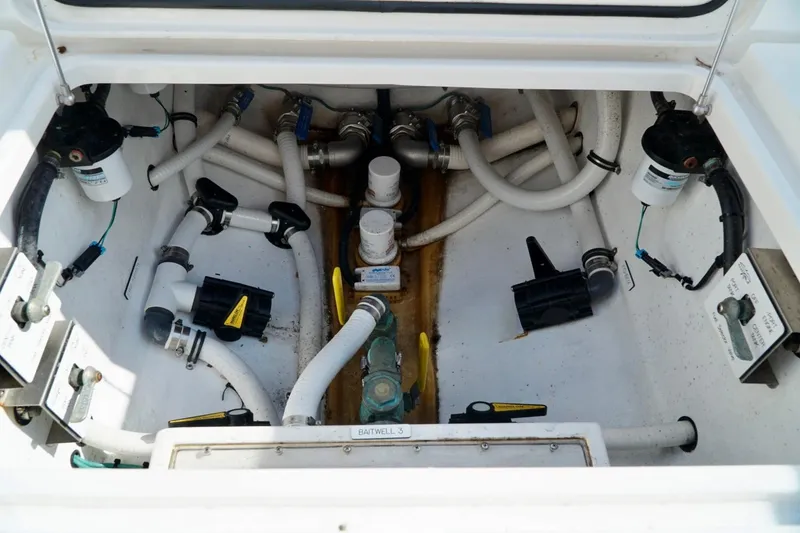 Slide: The Image of Boat bilge compartment with hoses, pumps, and filters, Invincible make. - 70
