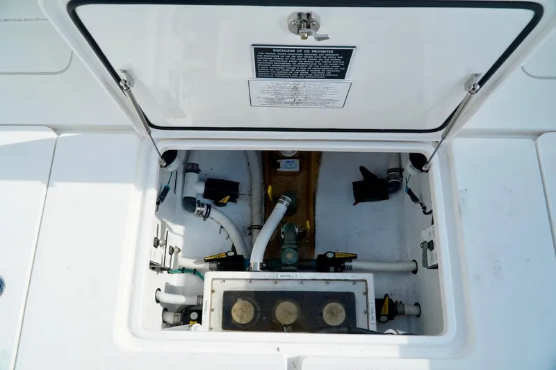 Slide: The Image of Open hatch of Invincible boat showing internal mechanical components. - 71