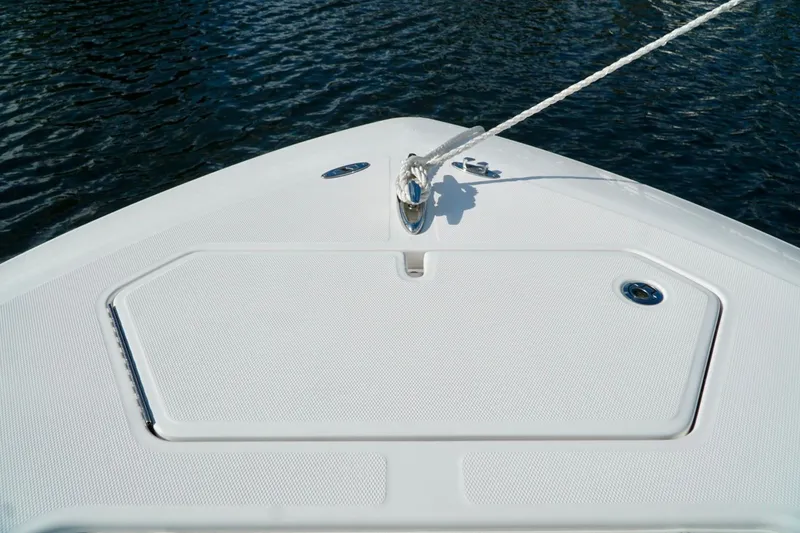 Slide: The Image of Bow of Invincible boat with anchor rope, on calm water. - 9