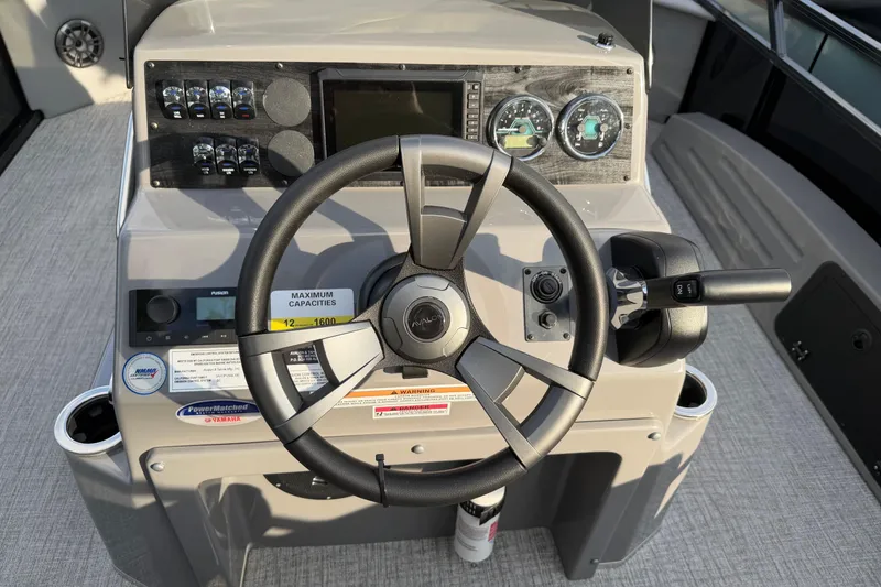 Slide: The Image of Steering console of 2026 Avalon VENTURE CC boat with modern controls and gauges. - 3