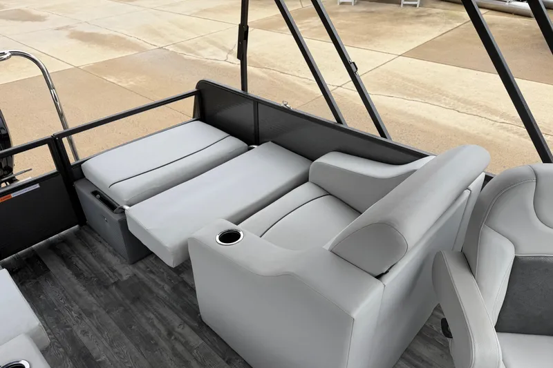 Slide: The Image of 2019 Crest I SLRC boat interior with gray seating and cup holders. - 15