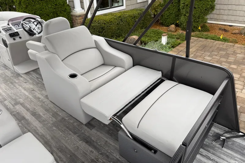 Slide: The Image of 2019 Crest I SLRC boat interior with gray seating and modern dashboard. - 16