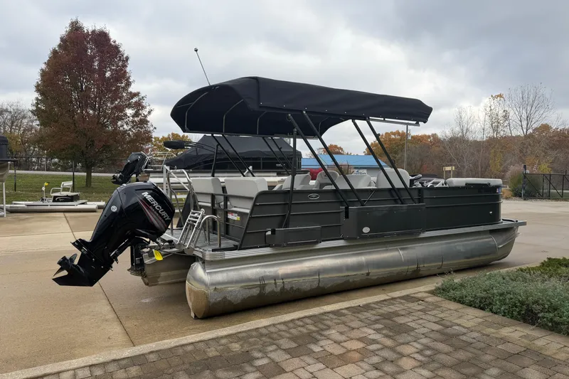 Slide: The Image of 2019 Crest I SLRC pontoon boat with canopy and Mercury outboard motor. - 2