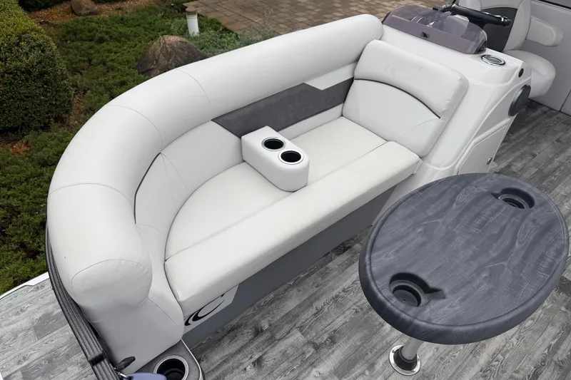Slide: The Image of 2019 Crest I SLRC boat interior with white seating and round table. - 5