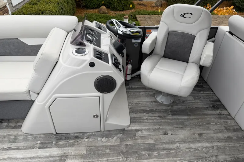 Slide: The Image of 2019 Crest I SLRC boat interior with captain's chair and control panel. - 6