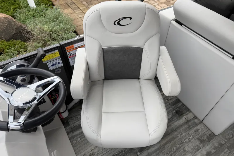 Slide: The Image of 2019 Crest I SLRC boat captain's chair and steering wheel, featuring sleek design and comfort. - 7