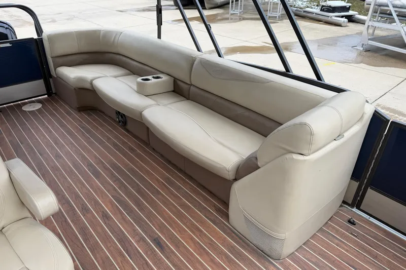 Slide: The Image of Luxurious seating on 2017 Crest 230SL Classic boat with wood-style flooring. - 11