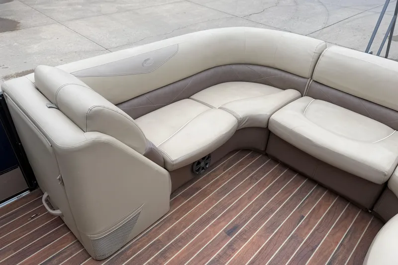 Slide: The Image of Luxurious seating on 2017 Crest 230SL Classic boat with elegant wood flooring. - 6