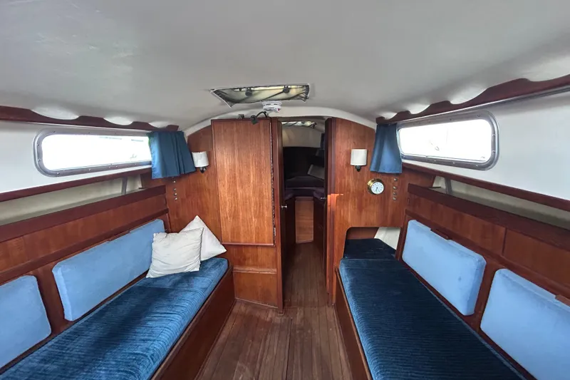 Slide: The Image of Interior of 1982 Sabre 30 sailboat with wooden finish and blue upholstery. - 5