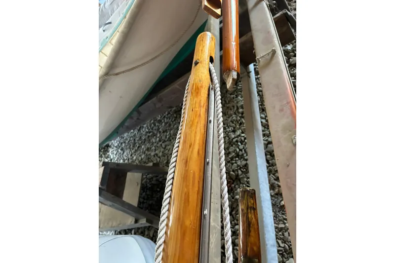 Slide: The Image of Wooden mast and rigging of a 1981 Herreshoff Doughdish 12.5 footer sailboat. - 15