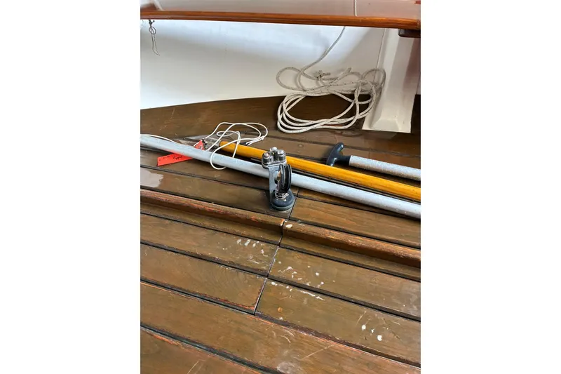 Slide: The Image of Interior of 1981 Herreshoff Doughdish 12.5 footer with ropes and wooden floor. - 16