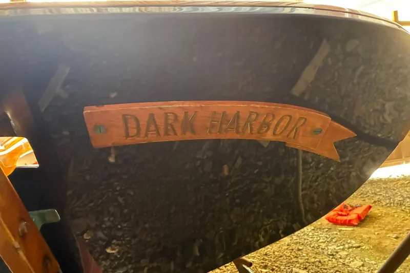 Slide: The Image of 1981 Herreshoff Doughdish 12.5 footer with "Dark Harbor" nameplate on hull. - 20