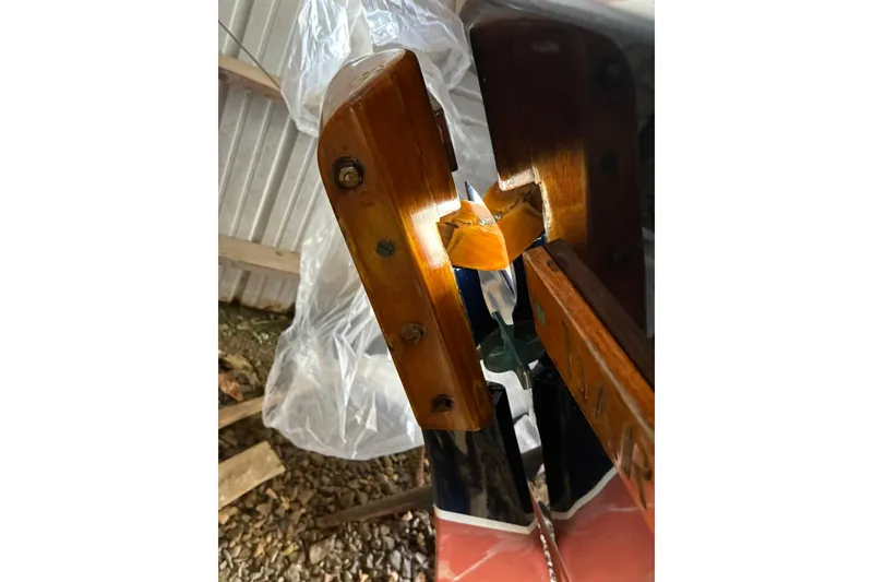 Slide: The Image of Close-up of 1981 Herreshoff Doughdish 12.5 footer's wooden rudder detail. - 21