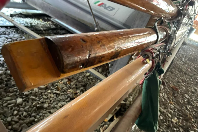 Slide: The Image of Wooden mast and rigging of a 1981 Herreshoff Doughdish 12.5 footer sailboat. - 22