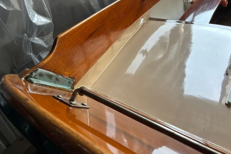 Slide: The Image of Polished wood detail of 1981 Herreshoff Doughdish 12.5 footer sailboat. - 7