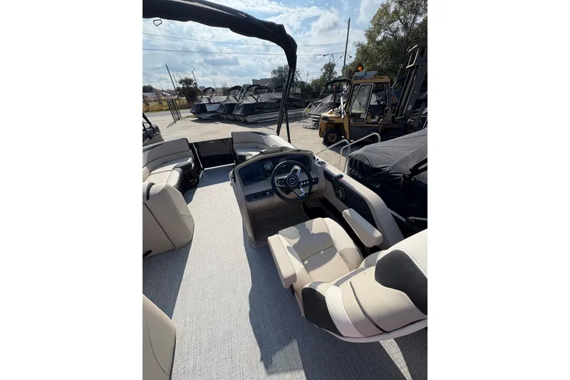 Slide: The Image of 2026 Avalon LSZ ELITE boat interior with modern seating and steering wheel. - 5