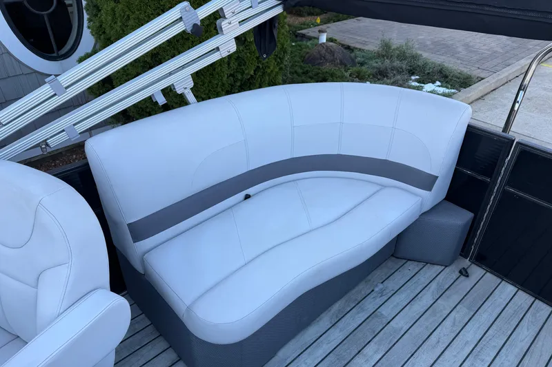 Slide: The Image of 2017 Crest I 220 SLC boat interior with white cushioned seating. - 10