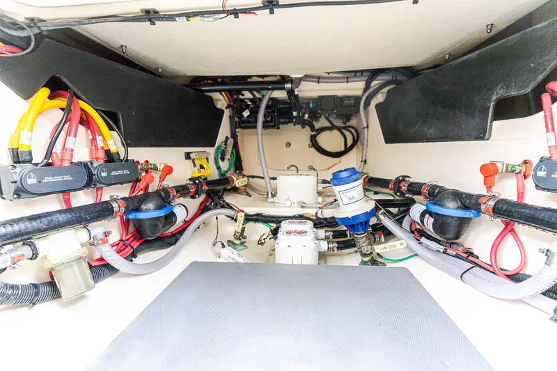 Slide: The Image of 2024 Scout 377 LXF boat wiring and plumbing system, showcasing organized cables and components. - 13