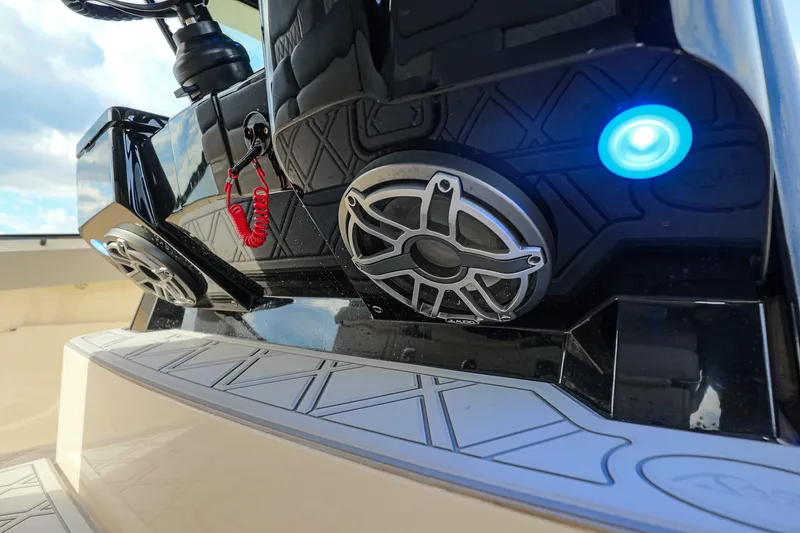Slide: The Image of 2024 Scout 377 LXF boat dashboard with speakers and blue LED light. - 34