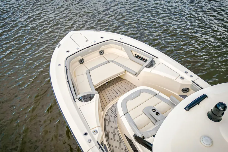 Slide: The Image of 2024 Scout 377 LXF boat interior with luxurious seating on calm water. - 5