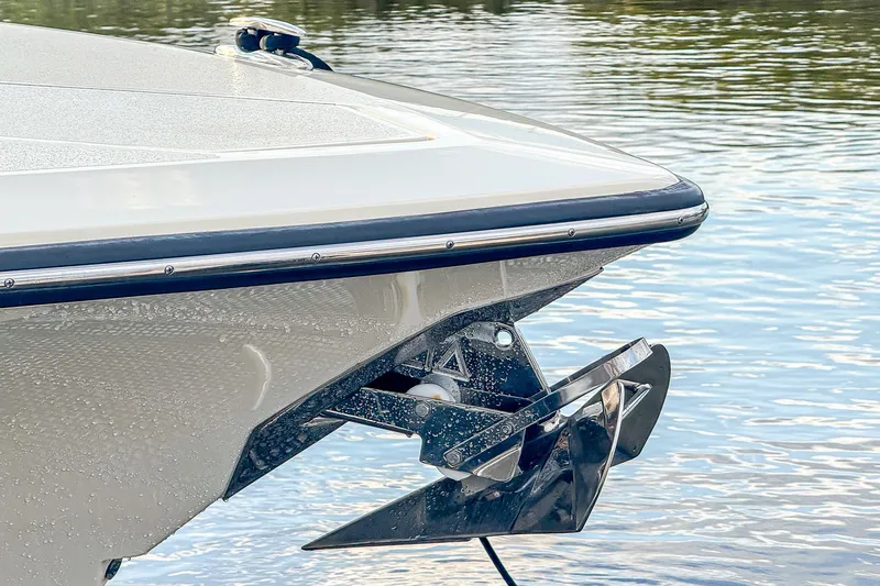 Slide: The Image of 2024 Scout 377 LXF boat bow with anchor, on calm water. - 75