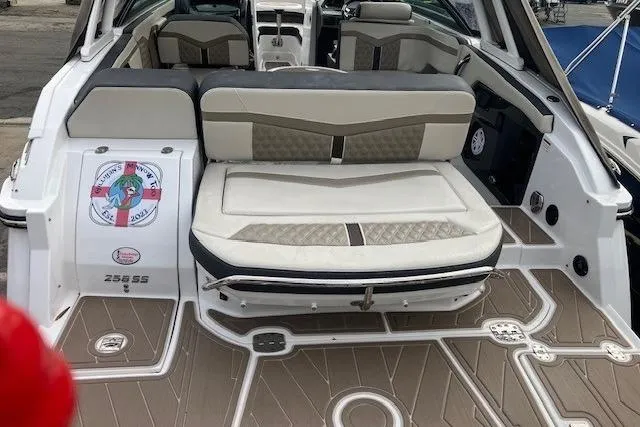 Slide: The Image of 2024 Monterey 258SS Super Sport boat interior with cushioned seating and stylish flooring. - 12