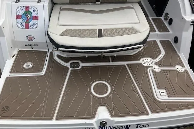 Slide: The Image of 2024 Monterey 258SS Super Sport boat deck with cushioned seating and custom flooring. - 13