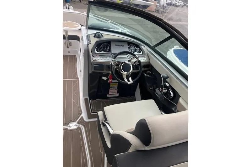 Slide: The Image of 2024 Monterey 258SS Super Sport boat interior with modern dashboard and steering wheel. - 4