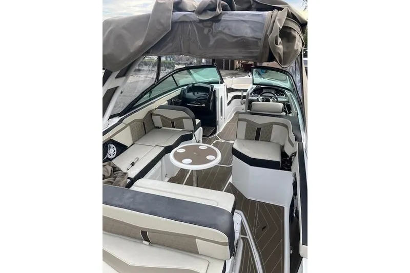 Slide: The Image of 2024 Monterey 258SS Super Sport boat interior with seating and table, showcasing luxury design. - 7