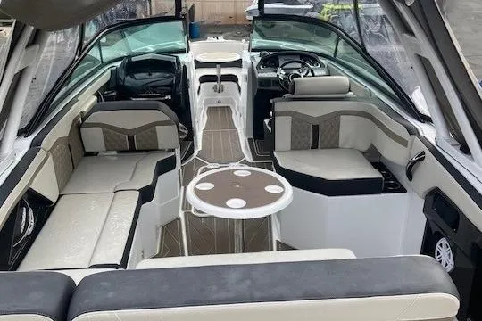 Slide: The Image of 2024 Monterey 258SS Super Sport boat interior with seating and table. - 9