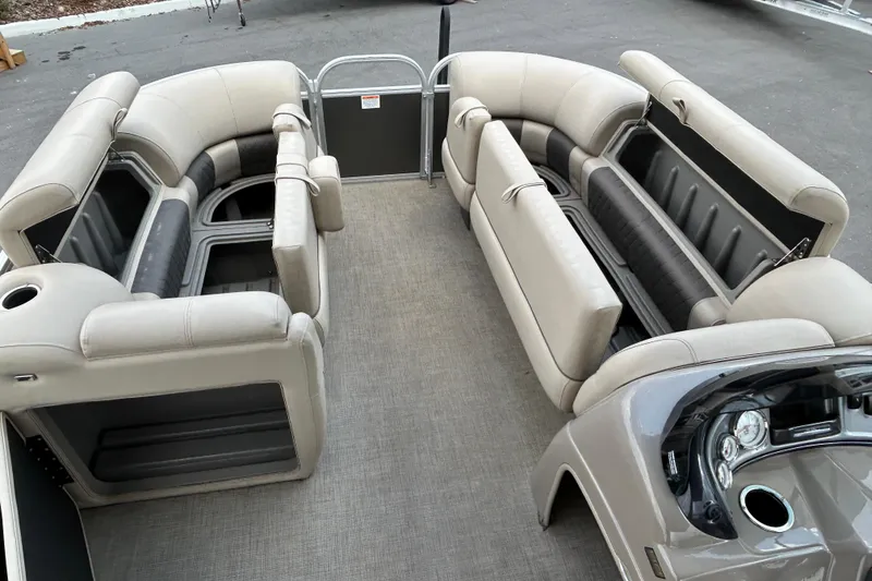 Slide: The Image of 2023 Sun Tracker Party Barge 20 DLX interior with spacious seating and modern dashboard. - 14
