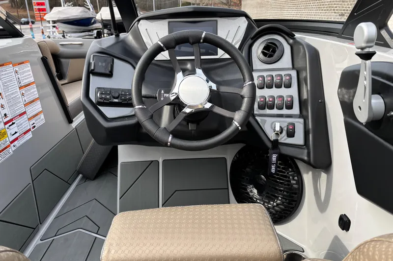 Slide: The Image of 2026 Supreme S240 boat dashboard with steering wheel, control panel, and modern design. - 10