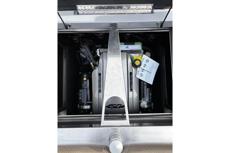 Slide: The Image of Engine compartment of 2026 Supreme S240 boat, showcasing mechanical components and labels. - 12