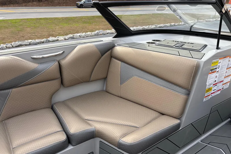 Slide: The Image of 2026 Supreme S240 boat interior with beige and gray seating, modern design. - 8