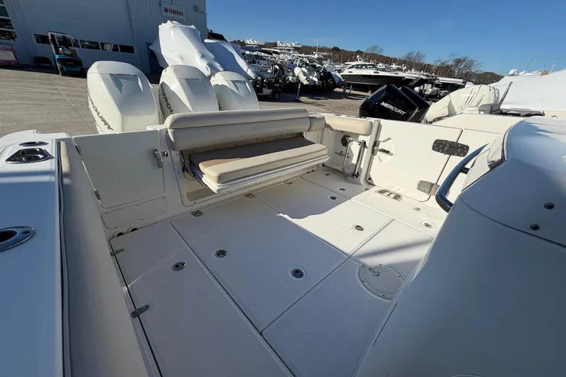 Slide: The Image of 2017 Boston Whaler 350 Outrage boat interior with seating and outboard engines. - 10