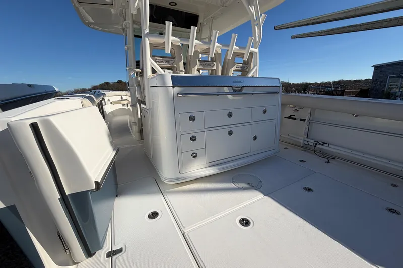 Slide: The Image of 2017 Boston Whaler 350 Outrage boat interior with seating and storage compartments. - 16