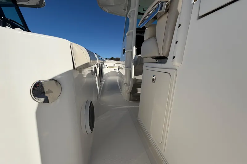 Slide: The Image of 2017 Boston Whaler 350 Outrage boat interior, showcasing sleek design and seating. - 17