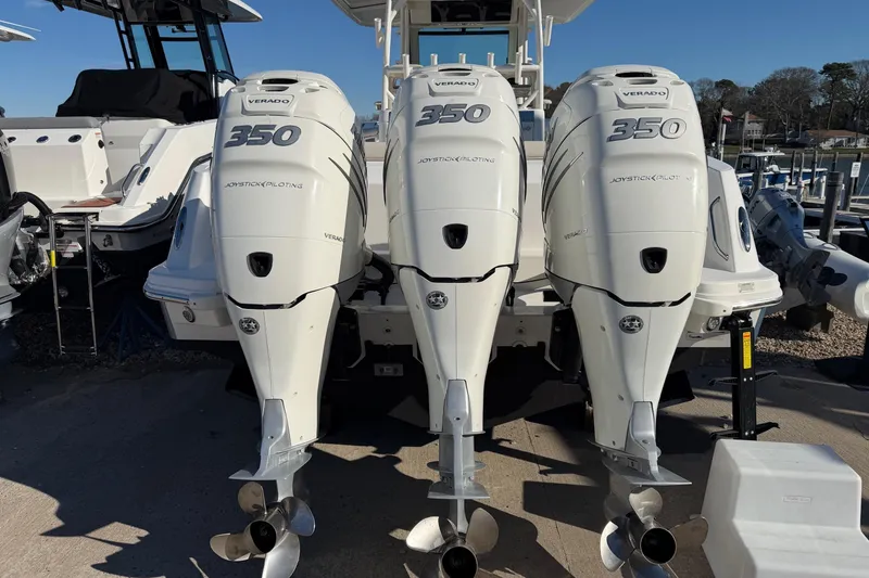 Slide: The Image of 2017 Boston Whaler 350 Outrage with triple Verado 350 engines at dock. - 2