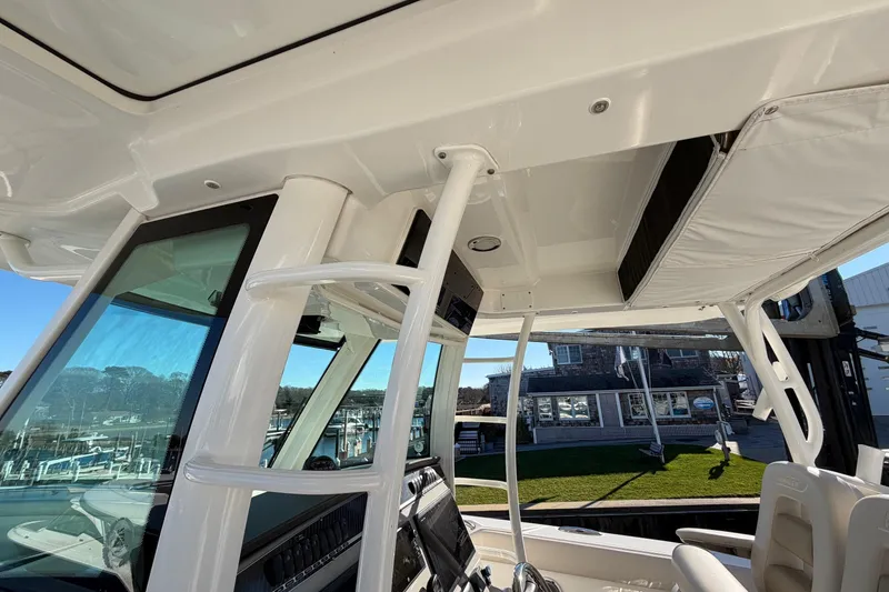 Slide: The Image of 2017 Boston Whaler 350 Outrage cockpit view with helm and seating. - 21