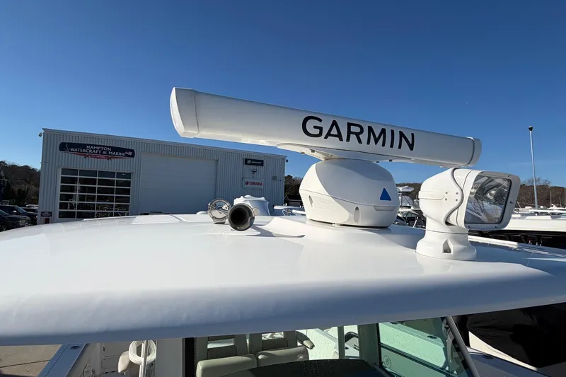 Slide: The Image of 2017 Boston Whaler 350 Outrage boat with Garmin radar, docked at marina. - 25