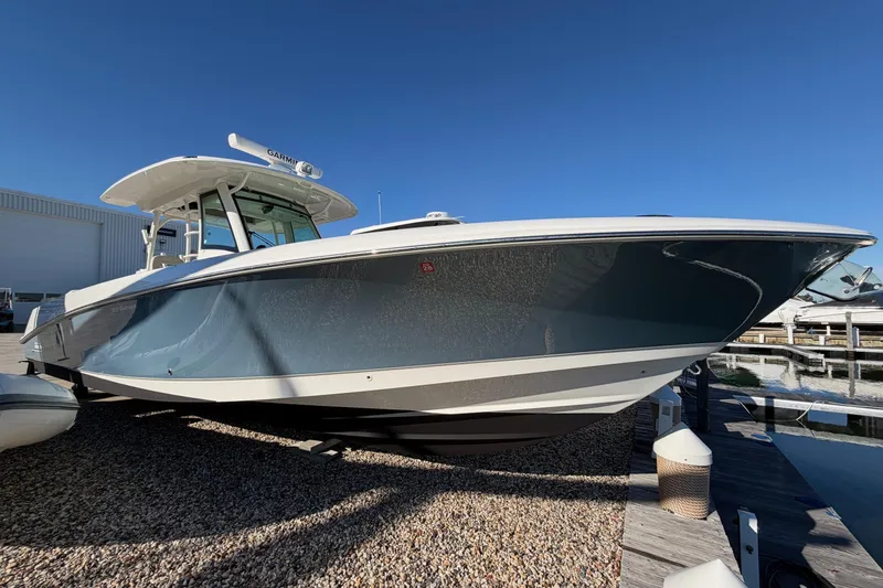 Slide: The Image of 2017 Boston Whaler 350 Outrage boat docked under clear blue sky. - 38