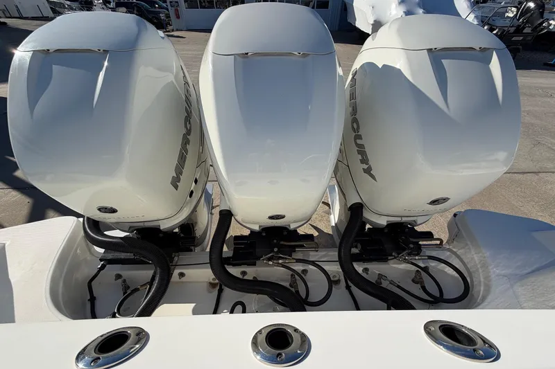 Slide: The Image of Triple Mercury outboard engines on a 2017 Boston Whaler 350 Outrage boat. - 8