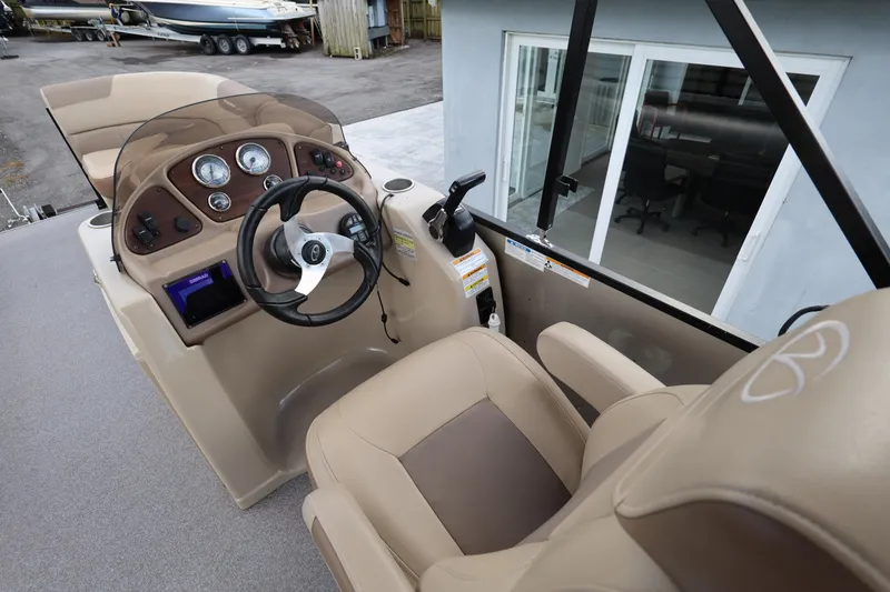 Slide: The Image of 2019 Veranda 22 VR boat helm with steering wheel and control panel. - 18