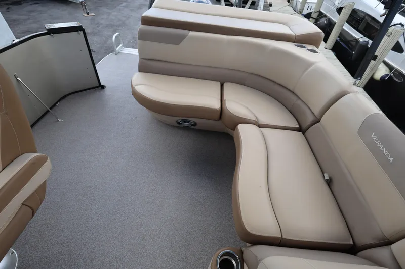 Slide: The Image of Luxurious seating on 2019 Veranda 22 VR boat, featuring beige upholstery and spacious layout. - 22