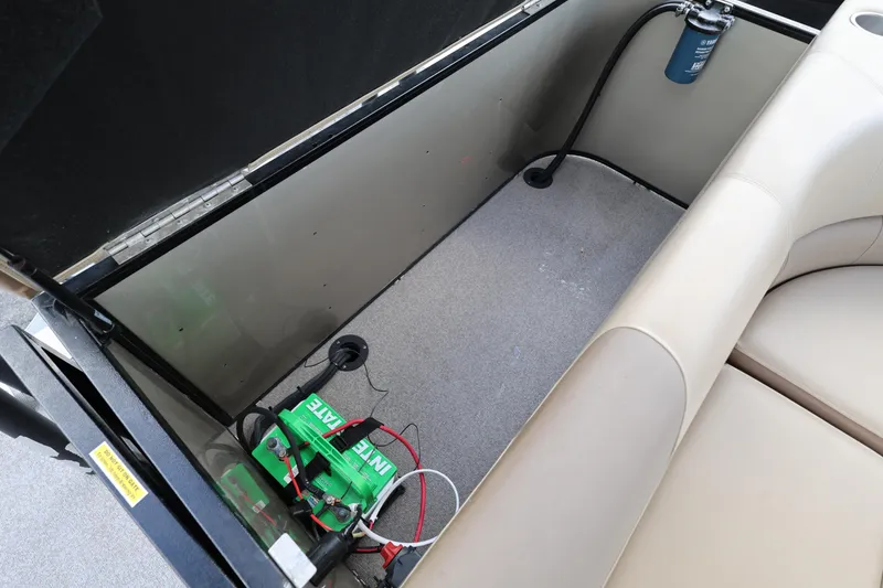 Slide: The Image of Open storage compartment in 2019 Veranda 22 VR boat with battery and wiring. - 23